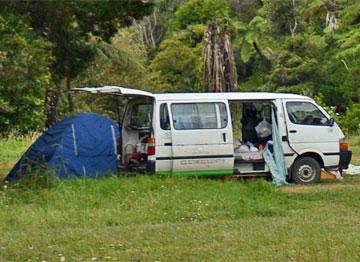 Camper parked by the river