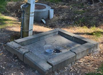 Closeup showing the damaged catchment and offset tap