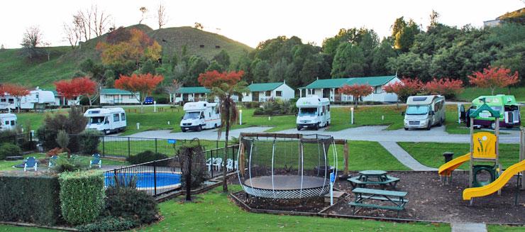 Motorhomes parked at the Waitomo Top 10 Holiday Park