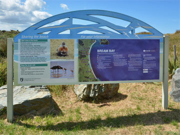 Bream Bay sign at the entrance to the beach