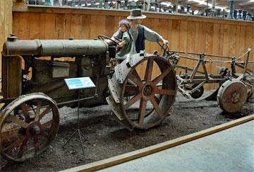 Early tractor pulling a plough