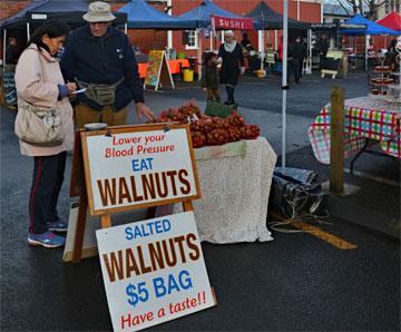 A stall offering local walnuts at the River Traders Market