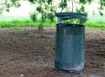 The barbecue area includes a rubbish bin