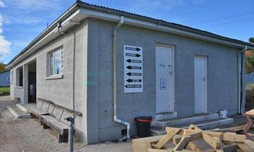 Toilets and showers at one end of the facilities building