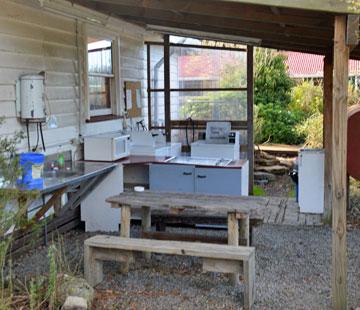 Very basic lean-to kitchen-dining area
