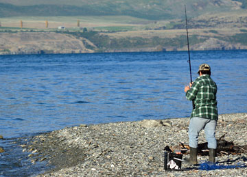 Fishing on the shore of Lake Whakatipu
