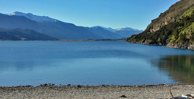 View of snow-capped mountains across the lake