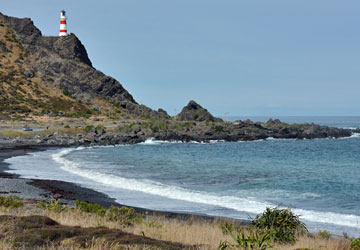 View of the lighthouse across a small bay
