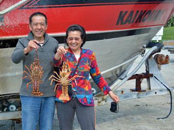 Xiangping and Shuping holding live crays