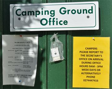 Campground sign on office door