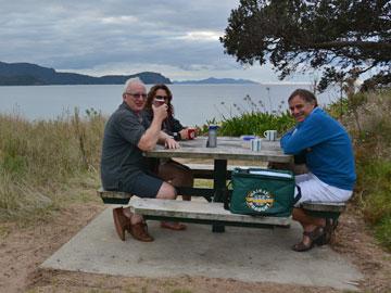 Visitors enjoying a drink by the beach